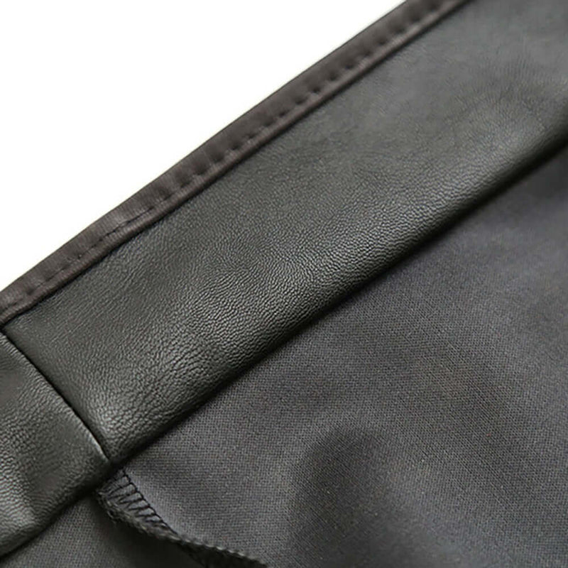 Close-up view of the Adjustable PVC Spanking Skirt With Built-In Thong Black M L showcasing glossy material texture.