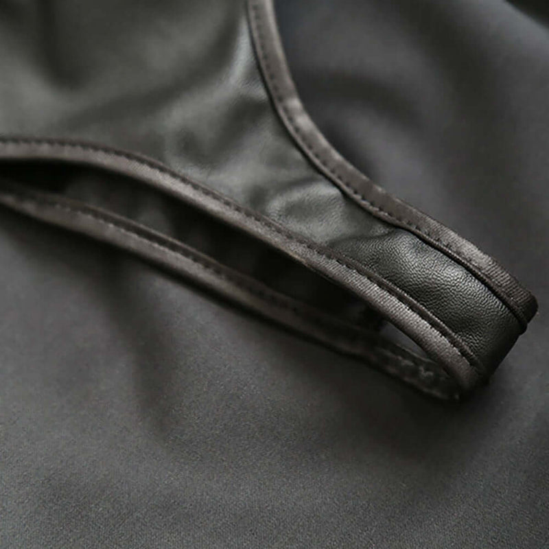 Close-up of the Adjustable PVC Spanking Skirt With Built-In Thong Black M L showing its sleek strap design.