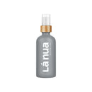 La Nua Unscented Silicone Lubricant 3.4 Oz in a sleek gray bottle with a bamboo pump.