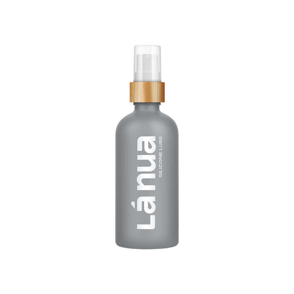 La Nua Unscented Silicone Lubricant 3.4 Oz in a sleek gray bottle with a bamboo pump.