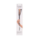 Sincerely Sportsheets Amber Layered Spanker Tortoiseshell packaging held by a hand, showcasing its elegant design.