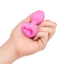 b-Vibe Vibrating Heart Anal Plug Small Medium Pink held in hand, showcasing its heart-shaped jewel design.