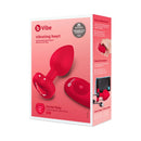 b-Vibe Vibrating Heart Anal Plug Medium Large Red packaging showing heart-shaped design and remote control.