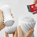 Tenga Flex Bubbly Blue Stroker demonstrating its spiral design and lubrication application.