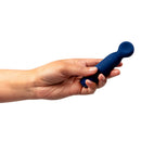 Person holding the Je Joue Vita Wand Tip Bullet Vibrator Cobalt Blue in a sleek, ergonomic design.
