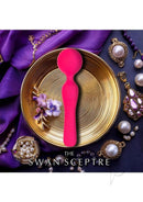 Swan Sceptre Silicone Dual End Wand Massager Berry on a gold plate surrounded by jewelry and purple fabric.