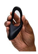 We-Vibe Verge 2 Silicone Vibrating Perineum Cock Ring Black held in hand showcasing its design.