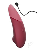 Womanizer Next Sensual Collection Air Clitoral Stimulator Red on a white background, showcasing its sleek design and controls.