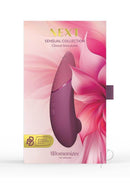 Womanizer Next Sensual Collection Air Clitoral Stimulator Pink in elegant packaging with floral design.