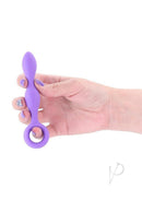 INYA Slim Silicone Anal Plug Purple being held, showcasing its sleek design and rich purple color.