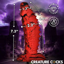 Creature Cocks Gojira Silicone Dildo featuring bold textures and dimensions in a dramatic city backdrop.