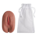 Cloud 9 Personal Pussy & Anal Body Mold Stroker Brown next to a storage bag, showing realistic design.