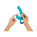 FemmeFunn Klio Triple Action Thumping Rabbit Vibrator Turquoise held in hands, showing its ergonomic design and features.