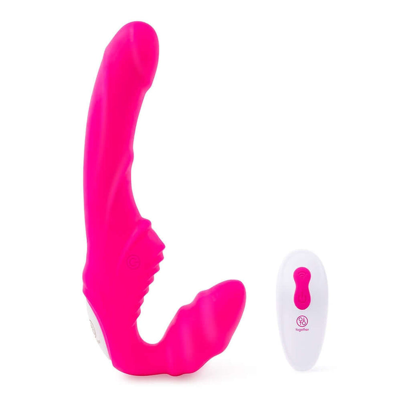 Together Strapless Remote Control Vibrator Pink next to its remote control, showcasing a vibrant design for couples' pleasure.