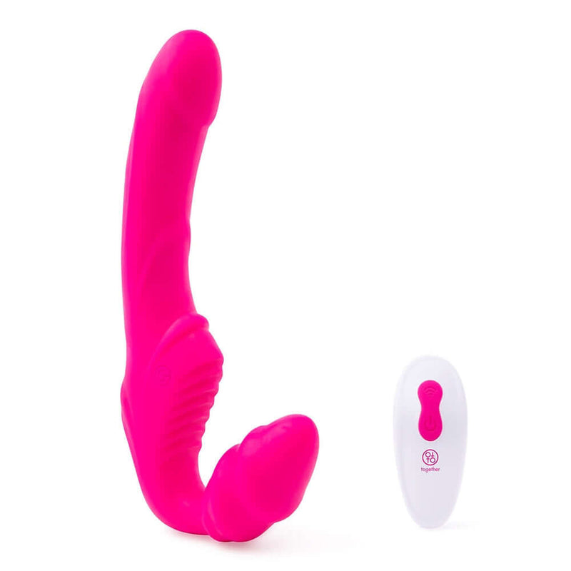 Together Strapless Remote Control Vibrator Pink next to its remote control, showcasing its vibrant design.