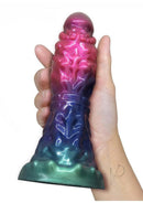 Alien Nation Expandor Inflatable Silicone Dildo Red Purple held in hand showcasing vibrant colors.