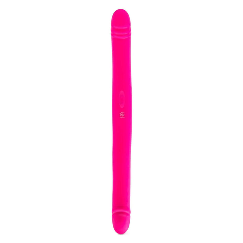Together Duo Pink Vibrating Dildo on a white background, showcasing its sleek design and vibrant color.