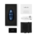 LELO NEA 3 Mini Silicone Vibrator Alien Blue in packaging with accessories including warranty card and USB charger.