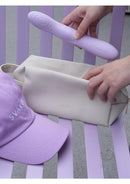 Svakom Selena Warming G-Spot Vibrator with Clitoral Stimulator next to a stylish carrying case and hat.