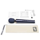 Le Wand Petite Rechargeable Vibrating Massager Navy with accessories and charging cable laid out on a white background.