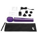 Le Wand Rechargeable Vibrating Massager Purple with accessories and charger on a white background.