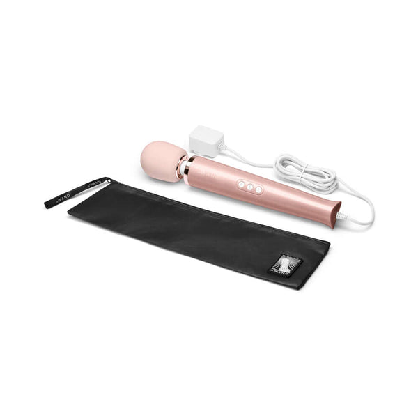 Le Wand Plug In Vibrating Massager Wand Rose Gold with black storage pouch and power cord.