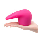 Le Wand Flick Flexible Silicone Attachment in hand, showcasing its flexible design and unique shape for targeted massage.
