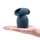 Le Wand Stroke Silicone Penis Play Attachment in a hand showcasing its size and textured interior design.