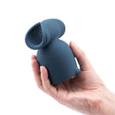 Le Wand Stroke Silicone Penis Play Attachment held in hand, showcasing textured silicone design for enhanced stimulation.