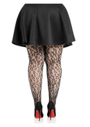 Leg Avenue Leopard Net Tights 1X 2X Black worn with a black skirt and high heels, showcasing the leopard net design.