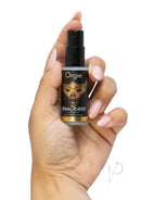 Orgie Oral Ease Deepthroat Spray Mint 0.5 Oz held in hand, designed for enhancing oral intimacy.