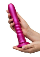 Romp Jiggle Thrusting Vibrating Dildo with Suction Cup Pink held in hand, showcasing its modern design and vibrant color.