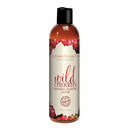 Intimate Earth Wild Cherries Glide 2 Oz bottle featuring a cherry design and natural flavor branding.