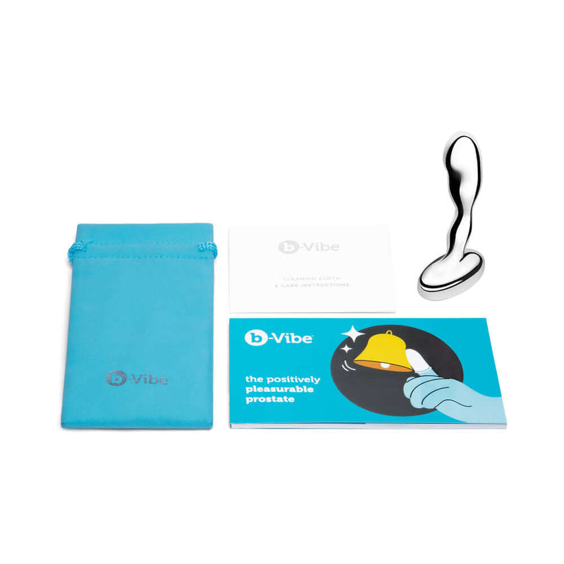 b-Vibe Stainless Steel Prostate Plug with storage pouch and instructional cards on a white background.