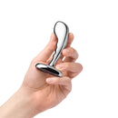 b Vibe Stainless Steel P Spot Plug Training Set held in hand, showcasing its sleek design and tapered base.