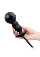 B-Vibe Beaded Inflatable Silicone Anal Plug Black held in hand, showcasing its beaded texture and adjustable design.