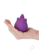 M'Lady Rose Flickering Tongue Clitoral Stimulator Purple in a hand, showcasing its compact design.