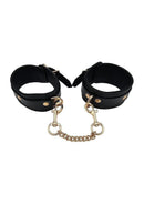 Leather Wrist Cuff Gold Accessories featuring adjustable black cuffs and elegant gold-tone hardware.