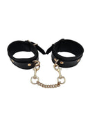 Leather Ankle Cuff With Gold Accessories featuring adjustable black leather cuffs and gold-tone hardware.