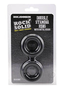 Rock Solid Silicone Double Stamina Cock Ring with Metal Beads packaging showing dual-ring design and bold branding.