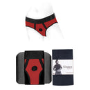 SpareParts Tomboi Nylon Briefs Harness Red Black Size M displayed on a mannequin with packaging.