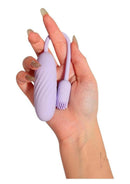 Svakom Plume Rechargeable Silicone Dual Vibrator Purple held in hand, featuring flexible tail and textured design.