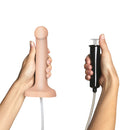 Hands holding Strap-On-Me Squirting Cum Dildo Small Vanilla and its pump for realistic play.