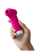 Lovense Fizz Oral-Like Suction & Tapping Stimulator in hand, showcasing its compact design and vibrant color.