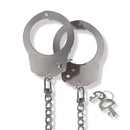 Nixie Metal Bondage 8-piece Kit Silver handcuffs with a chain and keys, perfect for power play and bondage exploration.