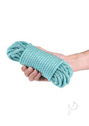 Bound 50 Feet Green Bondage Rope Non-Chafing held in a hand, ideal for sensual restraint.