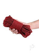 Bound 50 Foot Bondage Rope Red Non-Chafing held in hand, showcasing its soft texture and vibrant color.