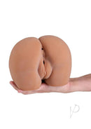 I Dream of Anal Stroker Jenny Caramel held in hand, showcasing its lifelike texture and design for enhanced pleasure.
