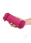 Bound Rope 50ft Pink Comfortable Non-Chafing held in a hand, showcasing its soft texture and vibrant color.
