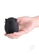 INYA The Vibrating Rose Silicone Clitoral Vibrator Black held in a hand, showcasing its discreet and elegant design.
